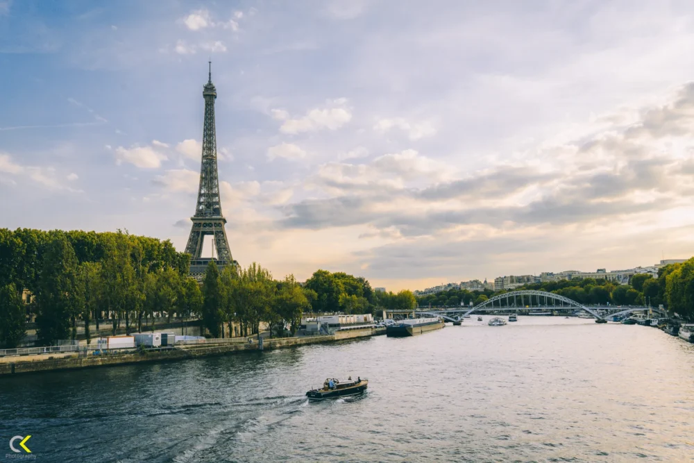 Golden Lights of Paris: Eiffel Tower & River at Dusk